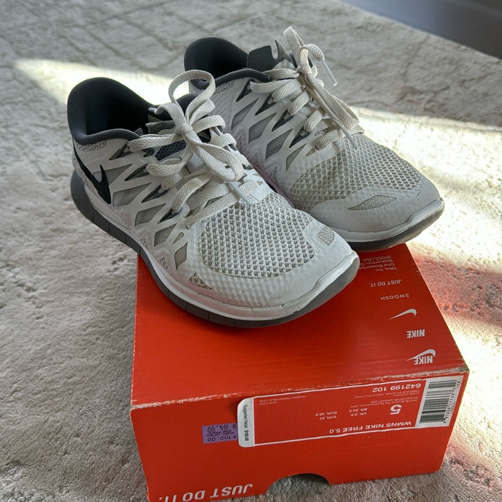 Nike women’s shoes. Size 5. White with grey and black swoosh.